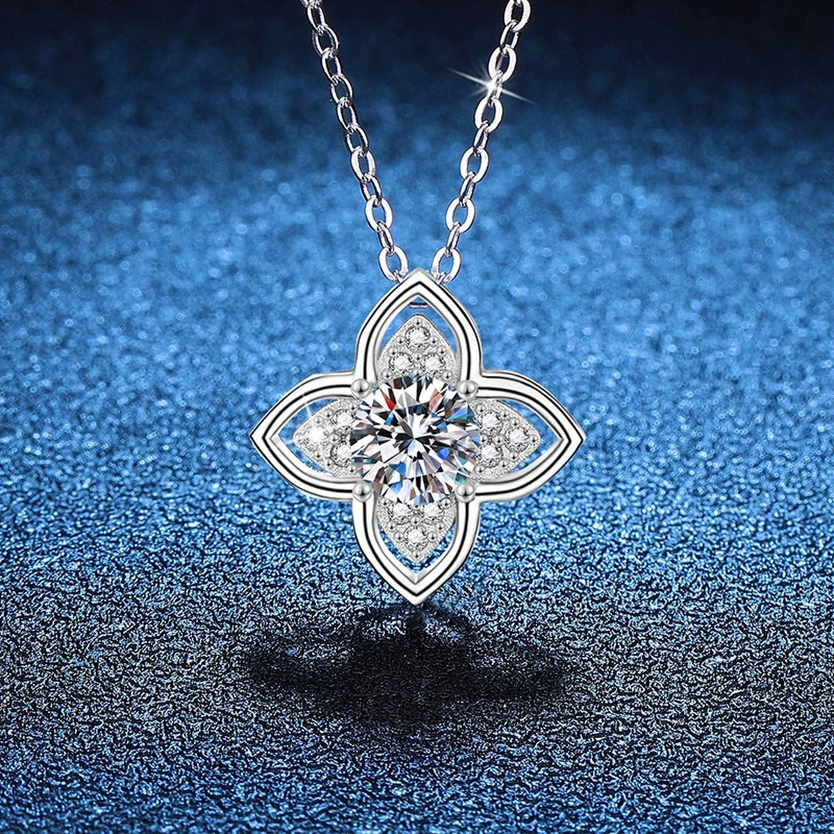 Four-Petal Halo Moissanite Pendant Necklace in Platinum-Plated S925 Sterling Silver blue background product view