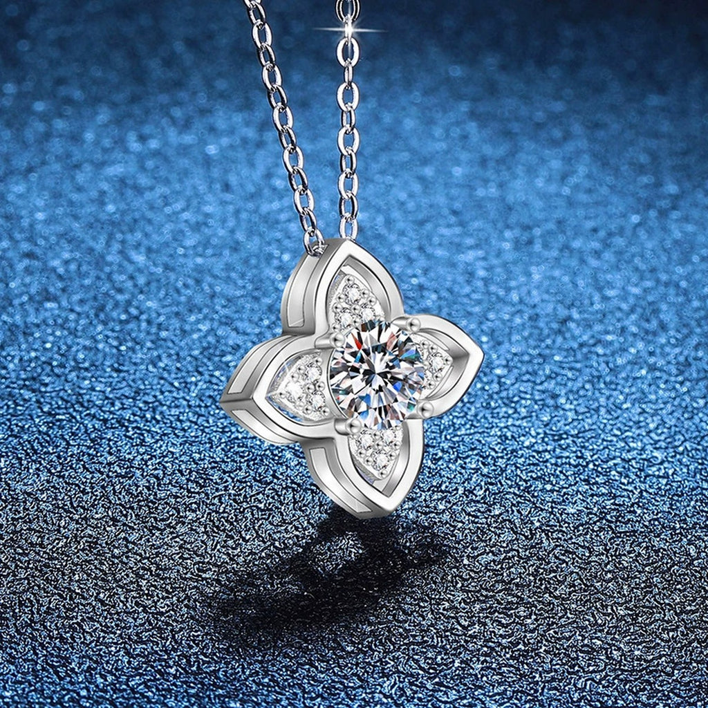 Four-Petal Halo Moissanite Pendant Necklace in Platinum-Plated S925 Sterling Silver blue background close-up view