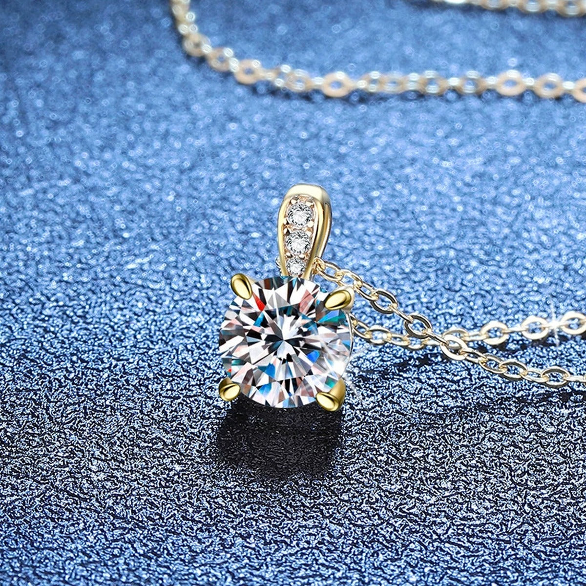 Round Moissanite Pendant Necklace with Cubic Zirconia Bail in S925 Sterling Silver blue background close-up view