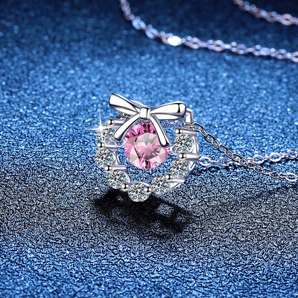 Bow Halo Moissanite Pendant Necklace with Cubic Zirconia in Platinum-Plated S925 Sterling Silver blue background product view
