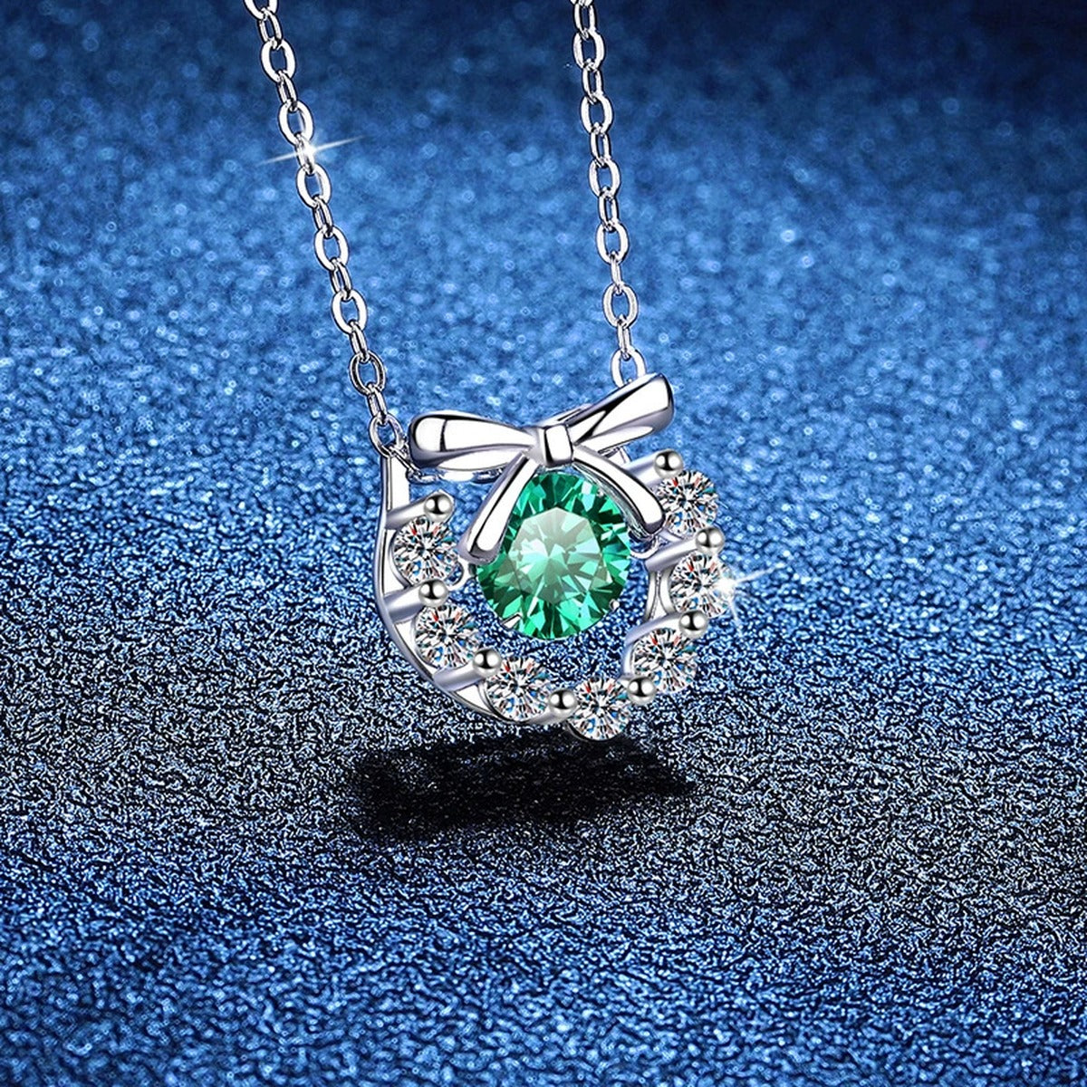 Bow Halo Moissanite Pendant Necklace with Cubic Zirconia in Platinum-Plated S925 Sterling Silver blue background styling view