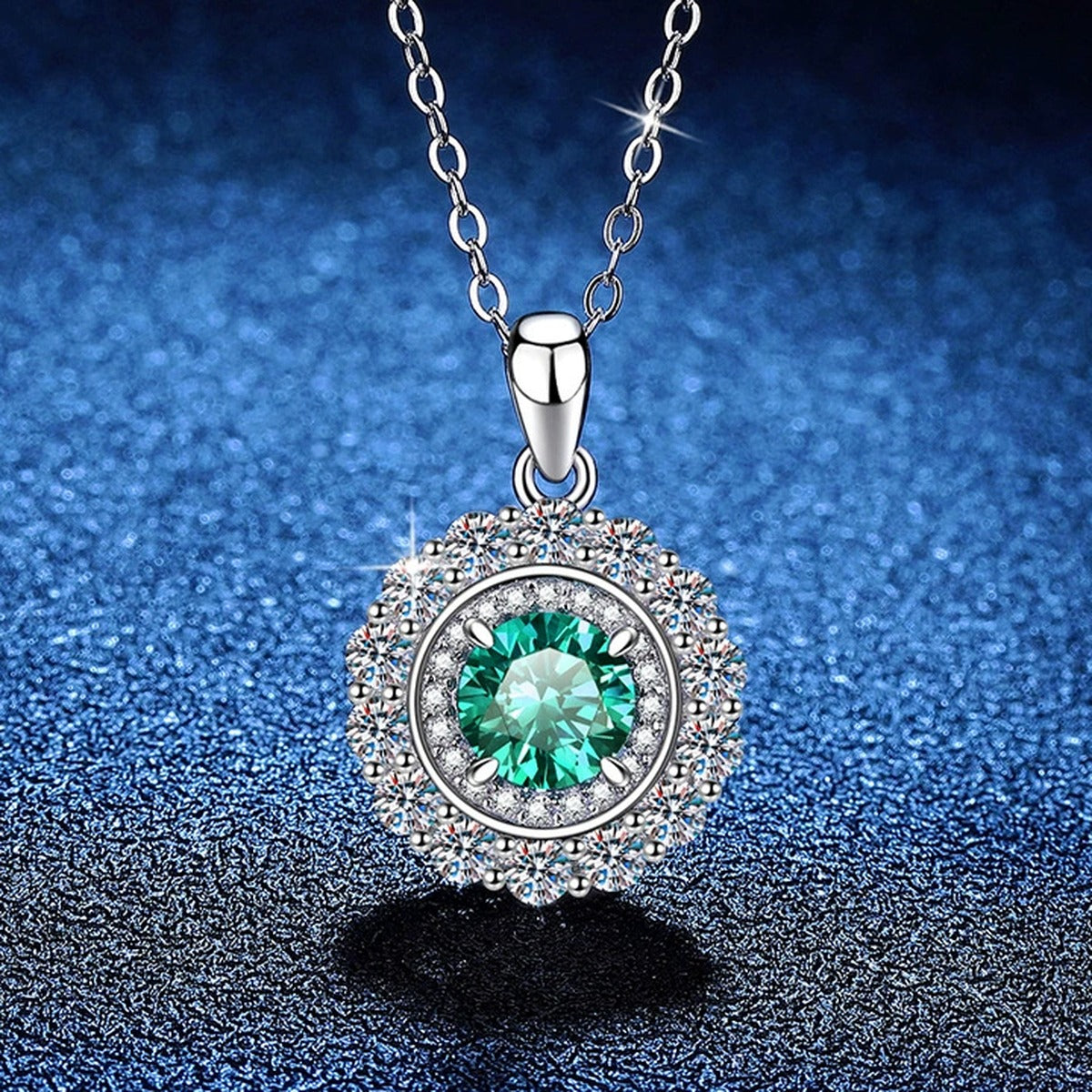 Colored Moissanite Halo Pendant Necklace in Platinum-Plated S925 Sterling Silver blue background angled view