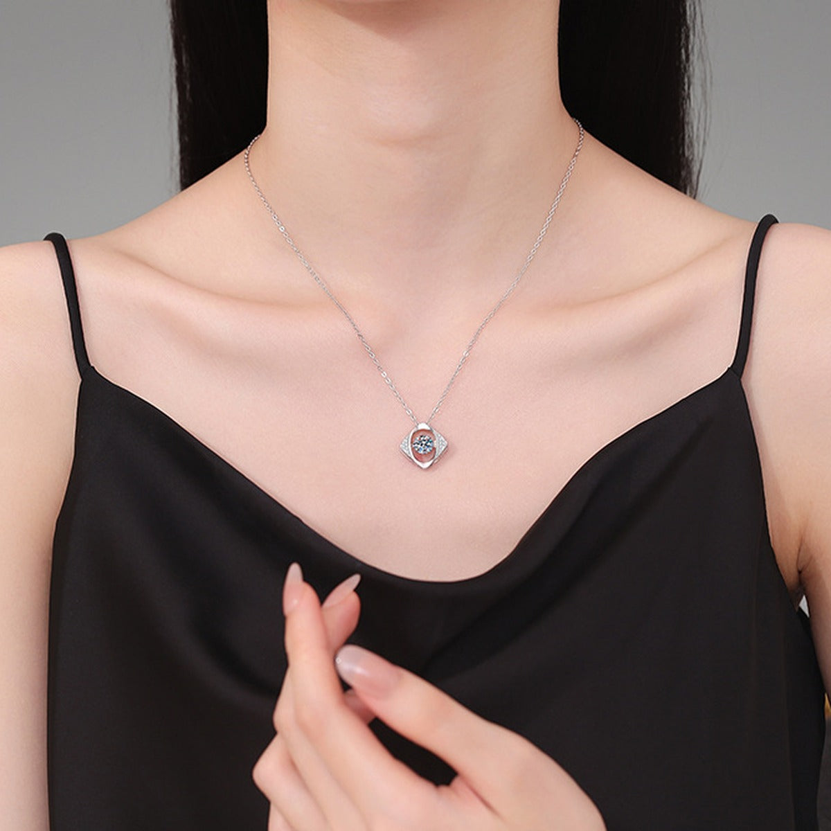 Evil Eye Moissanite Pendant Necklace with Cubic Zirconia in Platinum-Plated S925 Sterling Silver worn on neckline by model