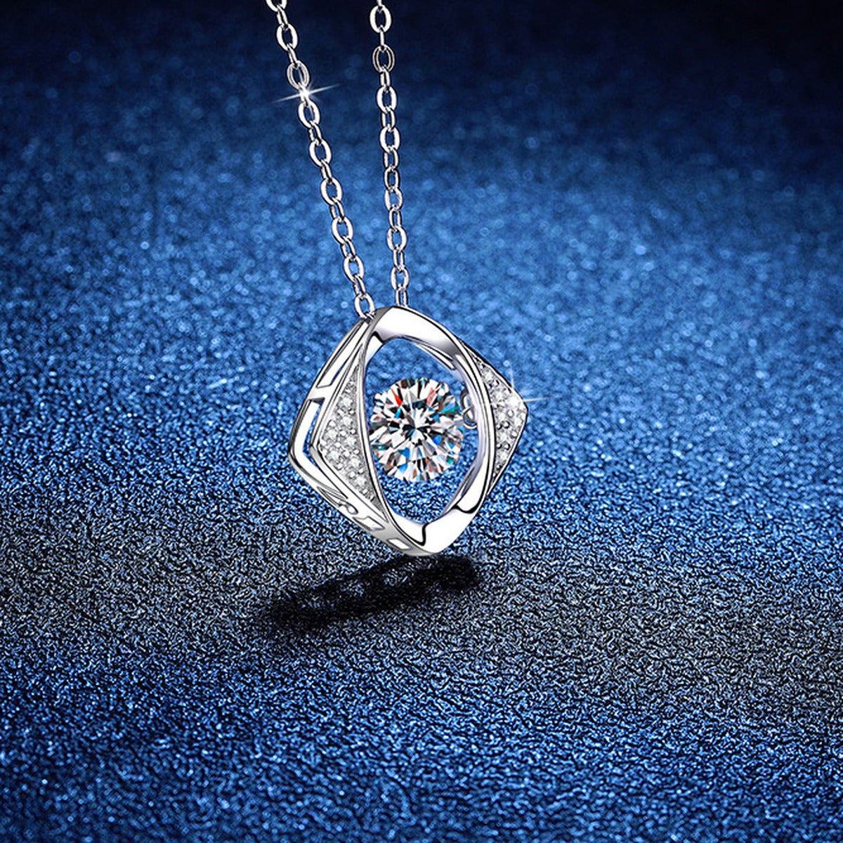 Evil Eye Moissanite Pendant Necklace with Cubic Zirconia in Platinum-Plated S925 Sterling Silver blue background angled view