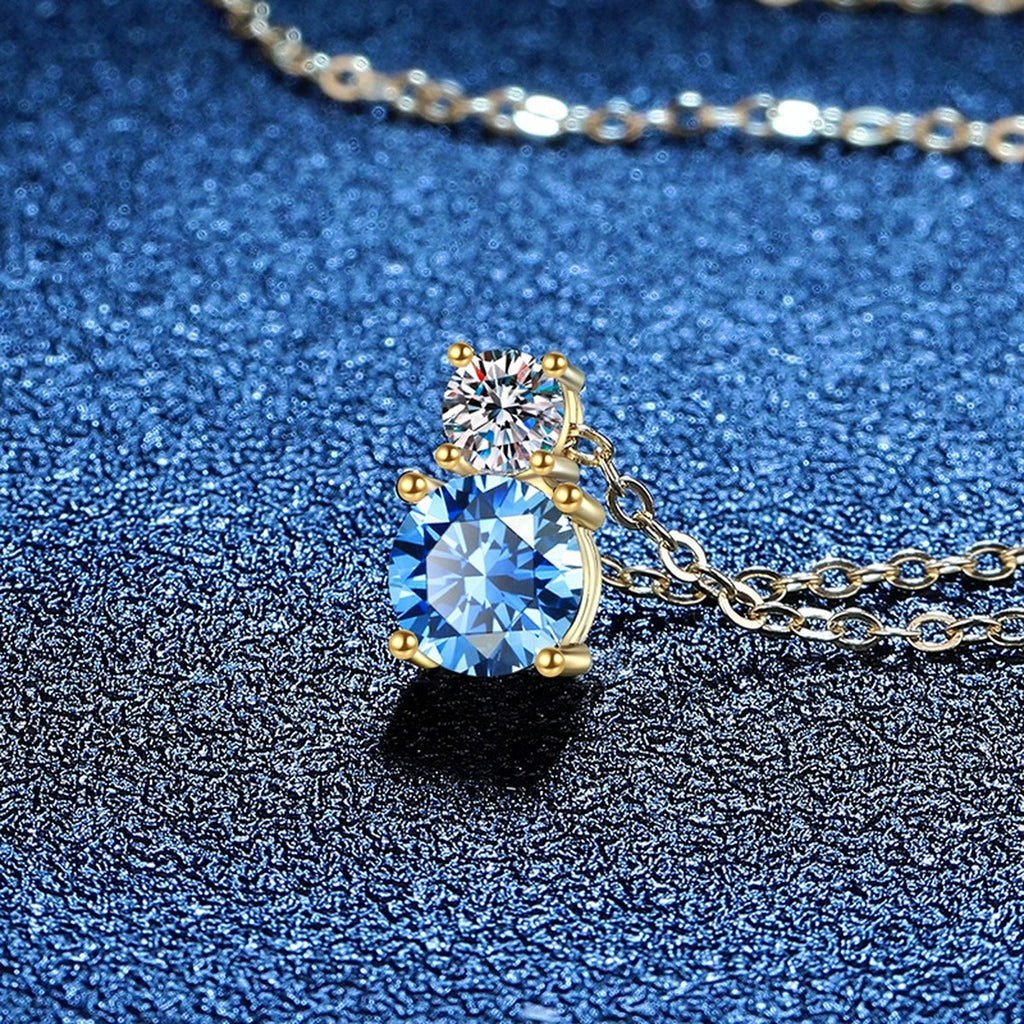 Two-Stone Drop Moissanite Pendant Necklace with Cubic Zirconia in 14K Yellow Gold-Plated S925 Sterling Silver blue background angled view