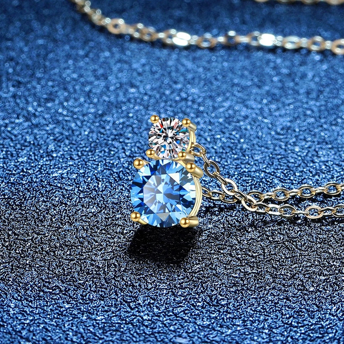 Two-Stone Drop Moissanite Pendant Necklace with Cubic Zirconia in 14K Yellow Gold-Plated S925 Sterling Silver blue background angled view