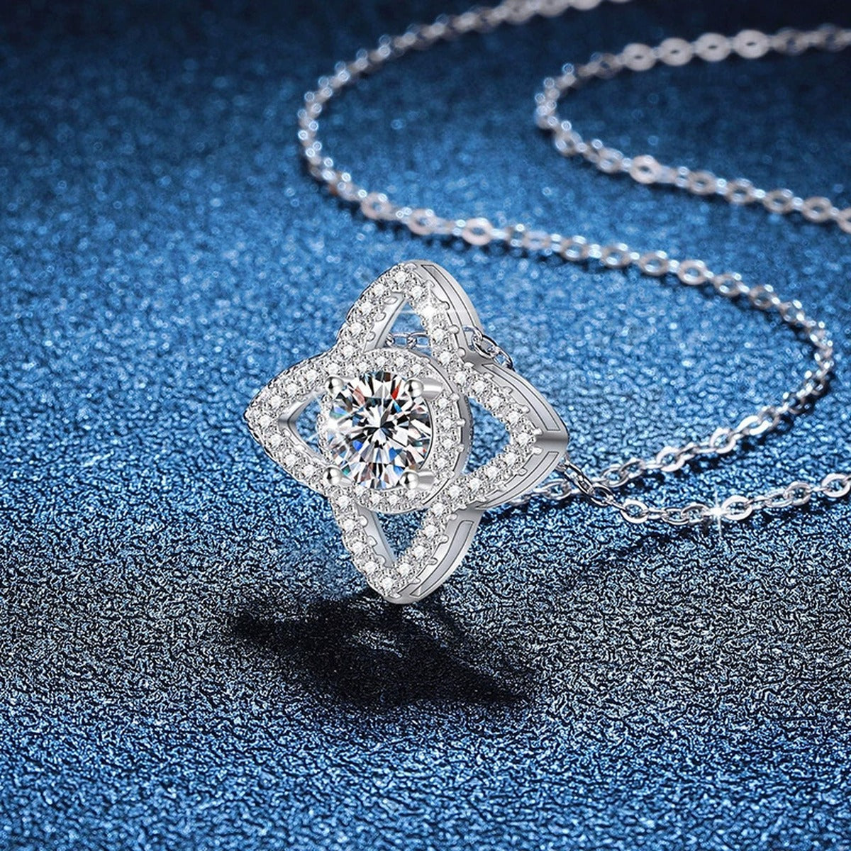 Four-Petal Halo Moissanite Pendant Necklace with Cubic Zirconia in Platinum-Plated S925 Sterling Silver blue background product view