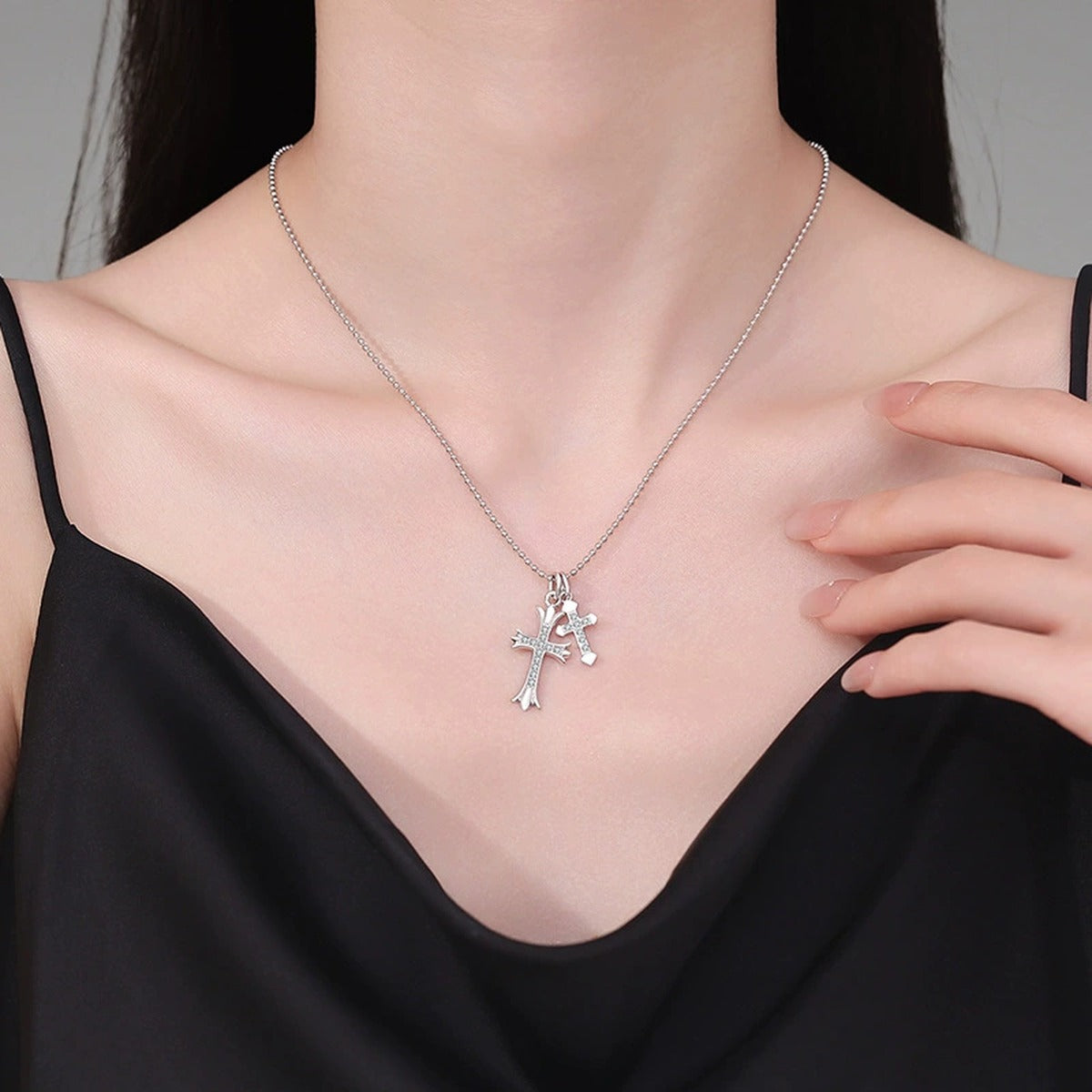 Cross Moissanite Pendant Necklace in Platinum-Plated S925 Sterling Silver worn on neckline by model