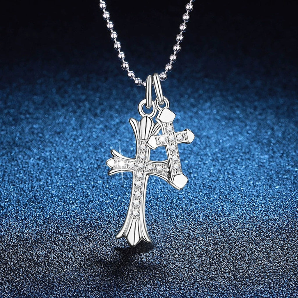 Cross Moissanite Pendant Necklace in Platinum-Plated S925 Sterling Silver blue background angled view