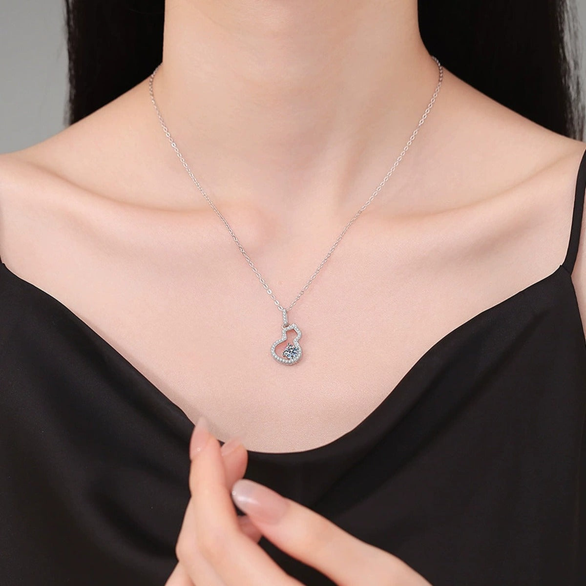 Open Heart Moissanite Pendant Necklace with Cubic Zirconia in Platinum-Plated S925 Sterling Silver worn on neckline by model