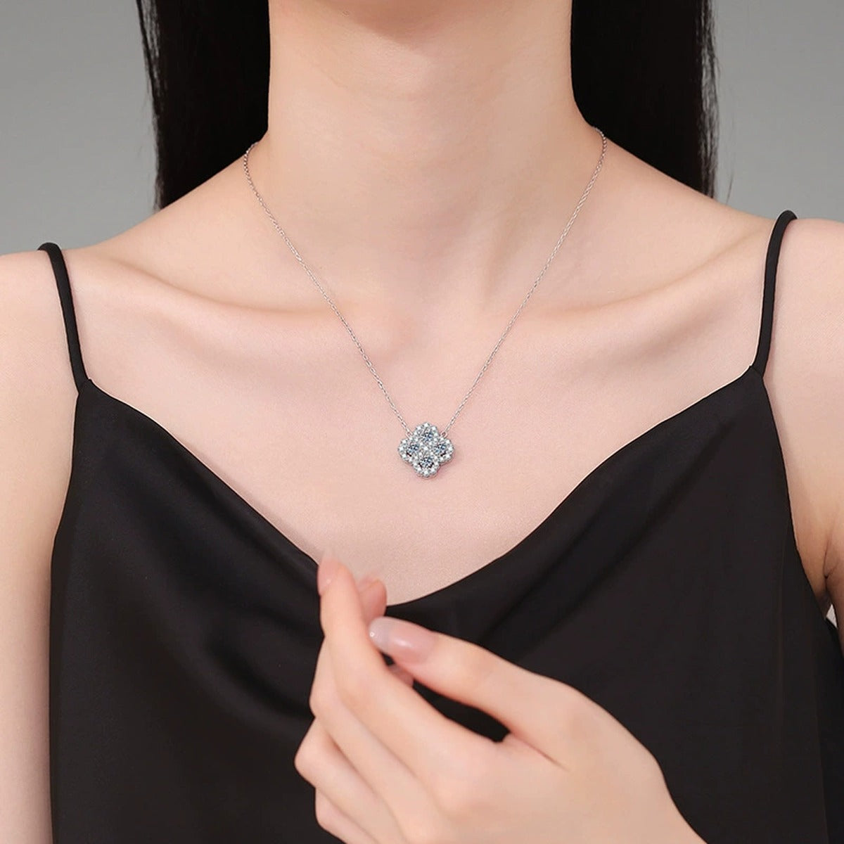 Four-Leaf Clover Moissanite Pendant Necklace with Cubic Zirconia in Platinum-Plated S925 Sterling Silver worn on neckline by model