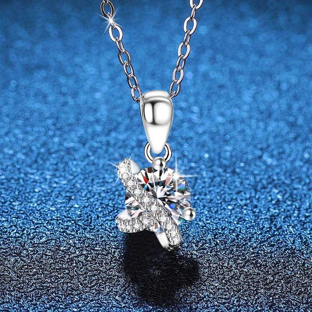 Butterfly Moissanite Pendant Necklace with Cubic Zirconia in Platinum-Plated S925 Sterling Silver blue background angled view