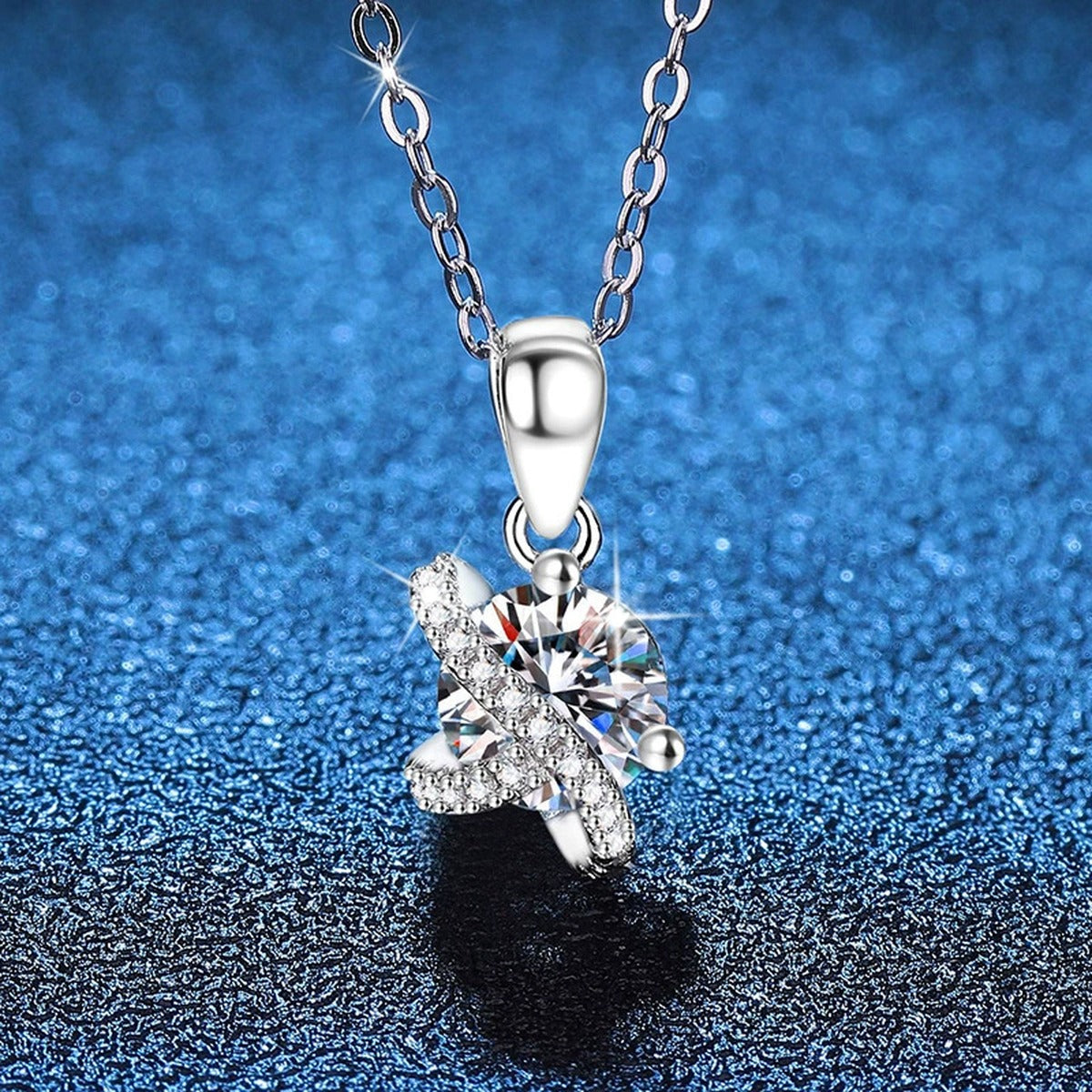 Butterfly Moissanite Pendant Necklace with Cubic Zirconia in Platinum-Plated S925 Sterling Silver blue background angled view