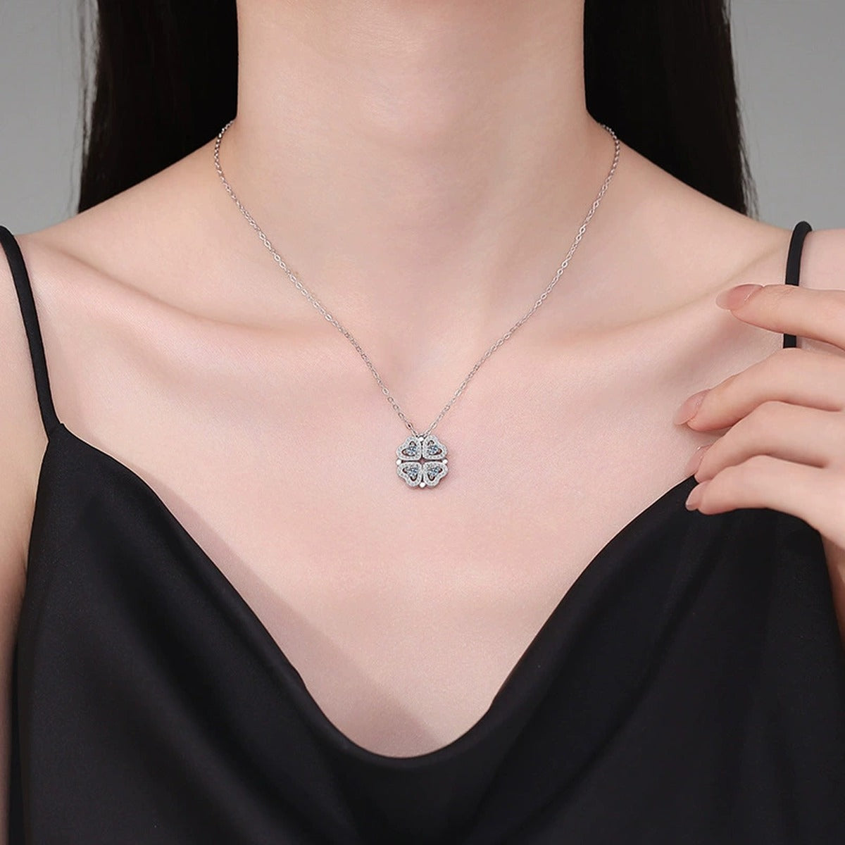 Four-Heart Clover Moissanite Pendant Necklace with Cubic Zirconia in Platinum-Plated S925 Sterling Silver worn on neckline by model