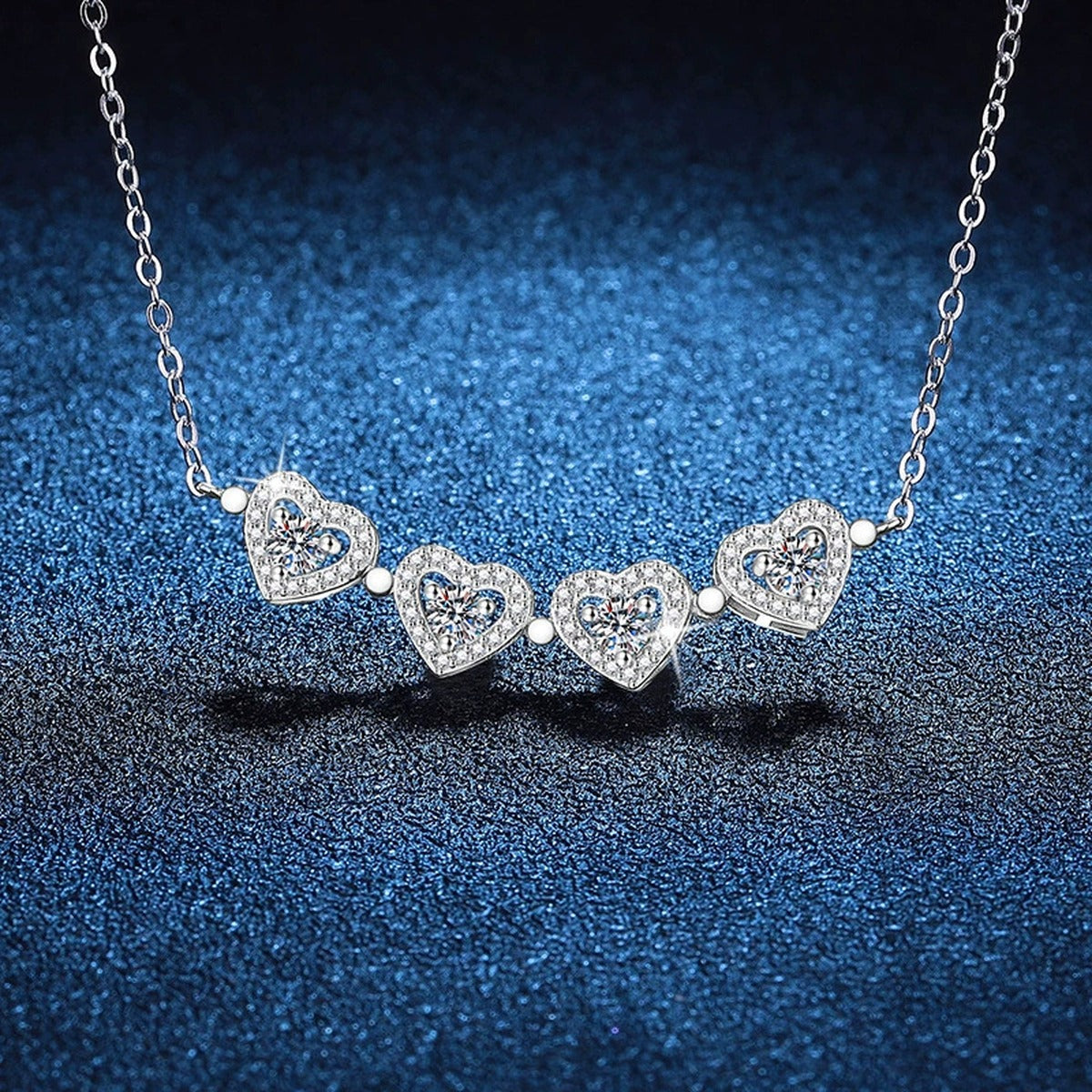 Four-Heart Clover Moissanite Pendant Necklace with Cubic Zirconia in Platinum-Plated S925 Sterling Silver blue background product view