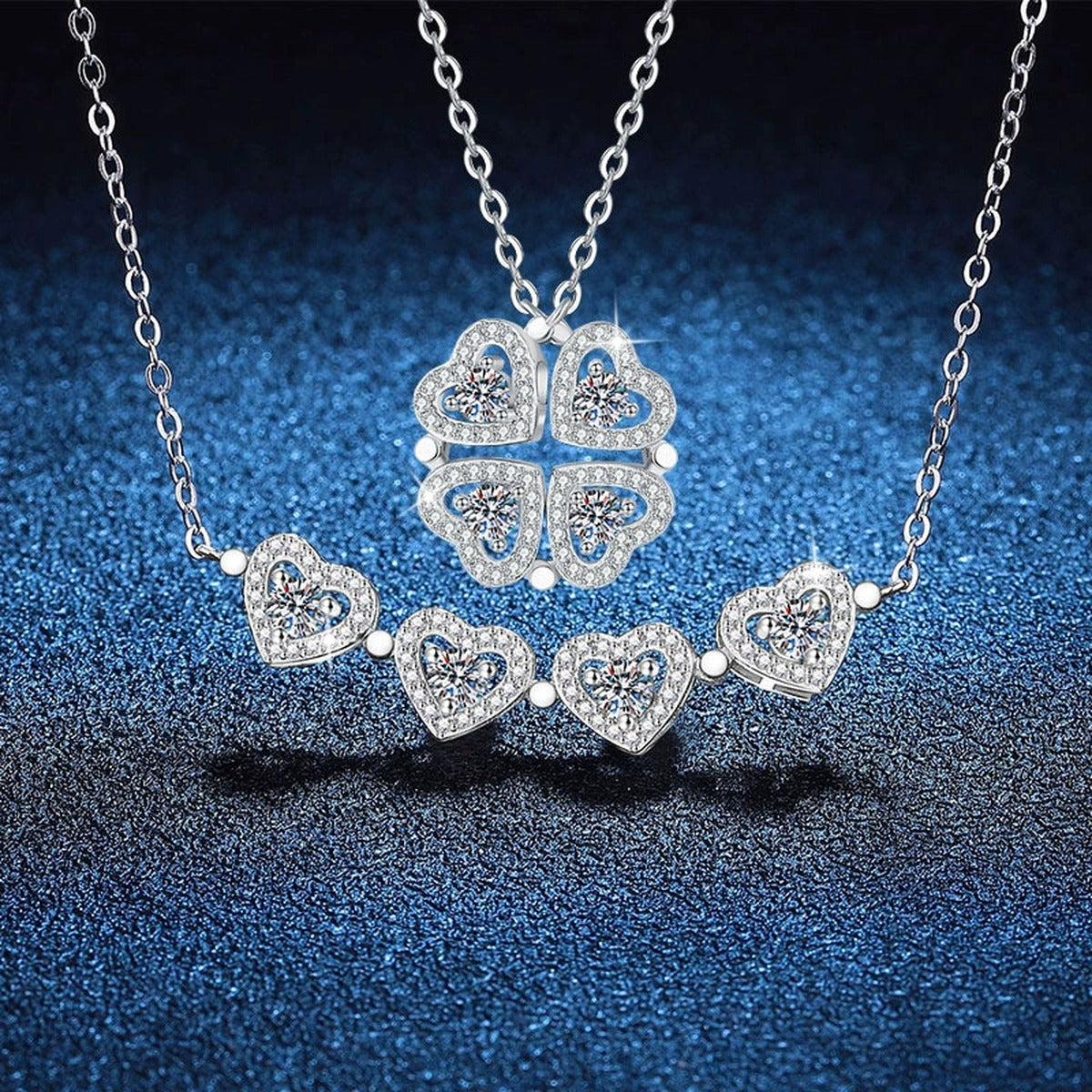 Four-Heart Clover Moissanite Pendant Necklace with Cubic Zirconia in Platinum-Plated S925 Sterling Silver blue background angled view
