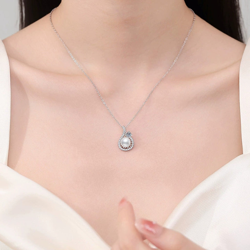 Pear Halo Moissanite Freshwater Pearl Pendant Necklace with Cubic Zirconia in White Gold-Plated S925 Sterling Silver worn on neckline by model