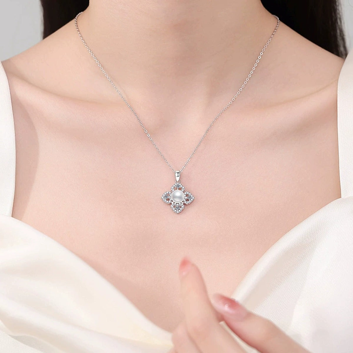 Clover Moissanite Freshwater Pearl Pendant Necklace with Cubic Zirconia in White Gold-Plated S925 Sterling Silver worn on neckline by model