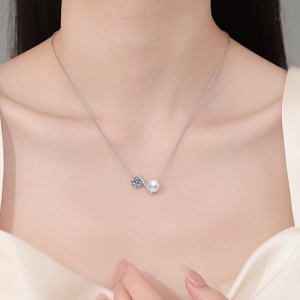 Wing Moissanite Freshwater Pearl Pendant Necklace with Cubic Zirconia in White Gold-Plated S925 Sterling Silver worn on neckline by model