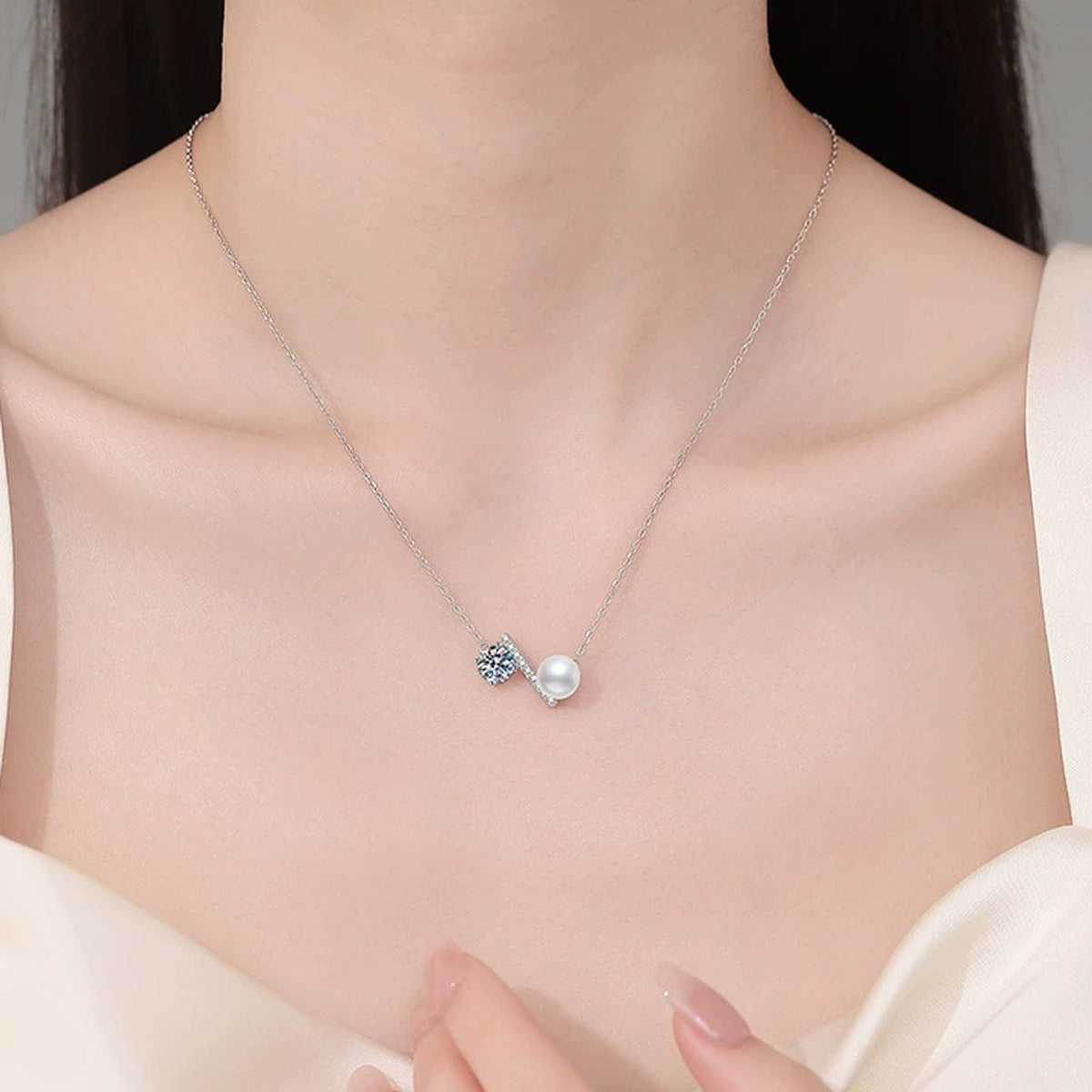 Wing Moissanite Freshwater Pearl Pendant Necklace with Cubic Zirconia in White Gold-Plated S925 Sterling Silver worn on neckline by model
