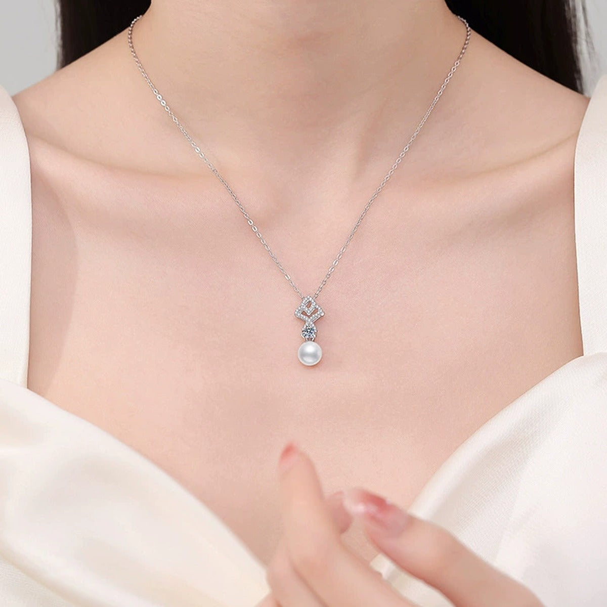 Geometric Moissanite Freshwater Pearl Pendant Necklace with Cubic Zirconia in White Gold-Plated S925 Sterling Silver worn on neckline by model