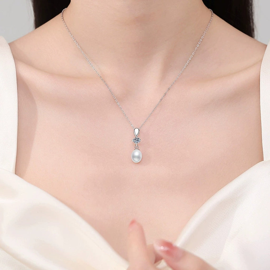 Drop Moissanite Freshwater Pearl Pendant Necklace in White Gold-Plated S925 Sterling Silver worn on neckline by model