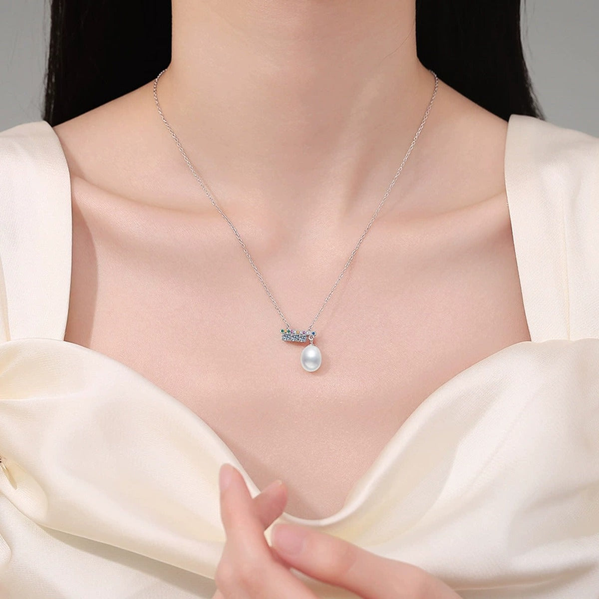 Bar Moissanite Freshwater Pearl Pendant Necklace with Cubic Zirconia in White Gold-Plated S925 Sterling Silver worn on neckline by model