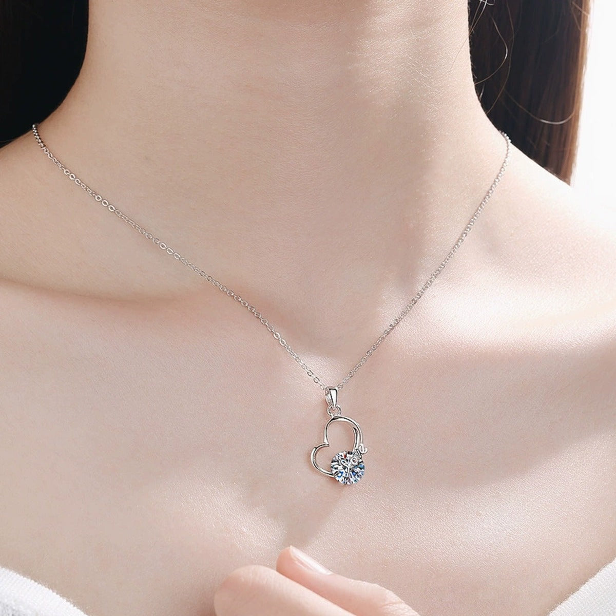 Open Heart Moissanite Pendant Necklace in Platinum-Plated S925 Sterling Silver worn on neckline by model