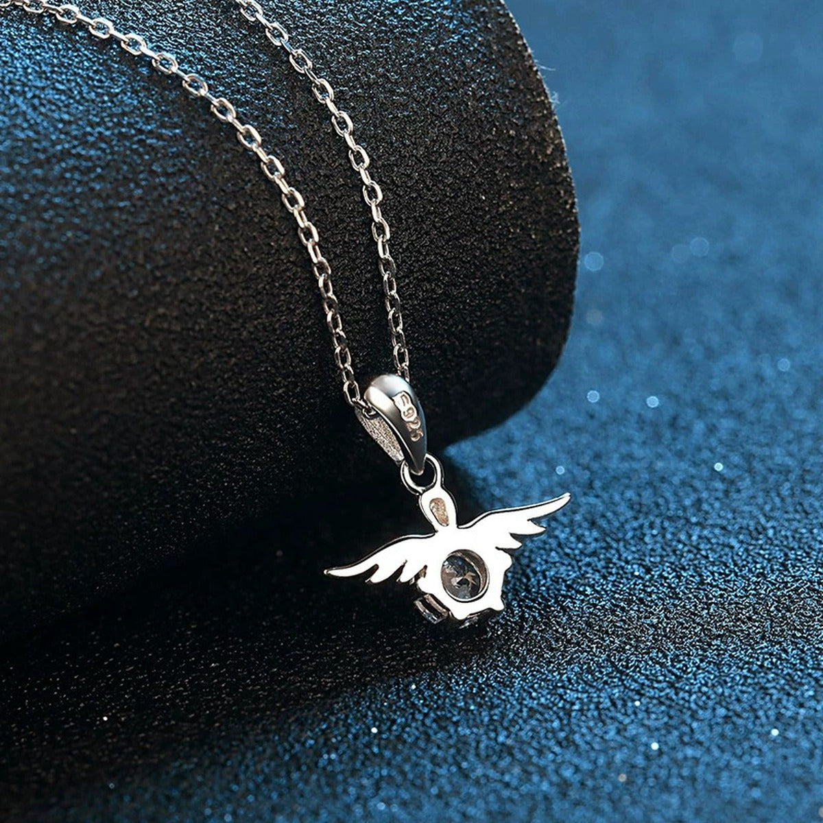Angel Wing Moissanite Pendant Necklace in Platinum-Plated S925 Sterling Silver blue background product view