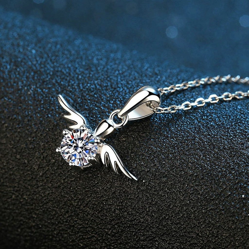 Angel Wing Moissanite Pendant Necklace in Platinum-Plated S925 Sterling Silver blue background angled view