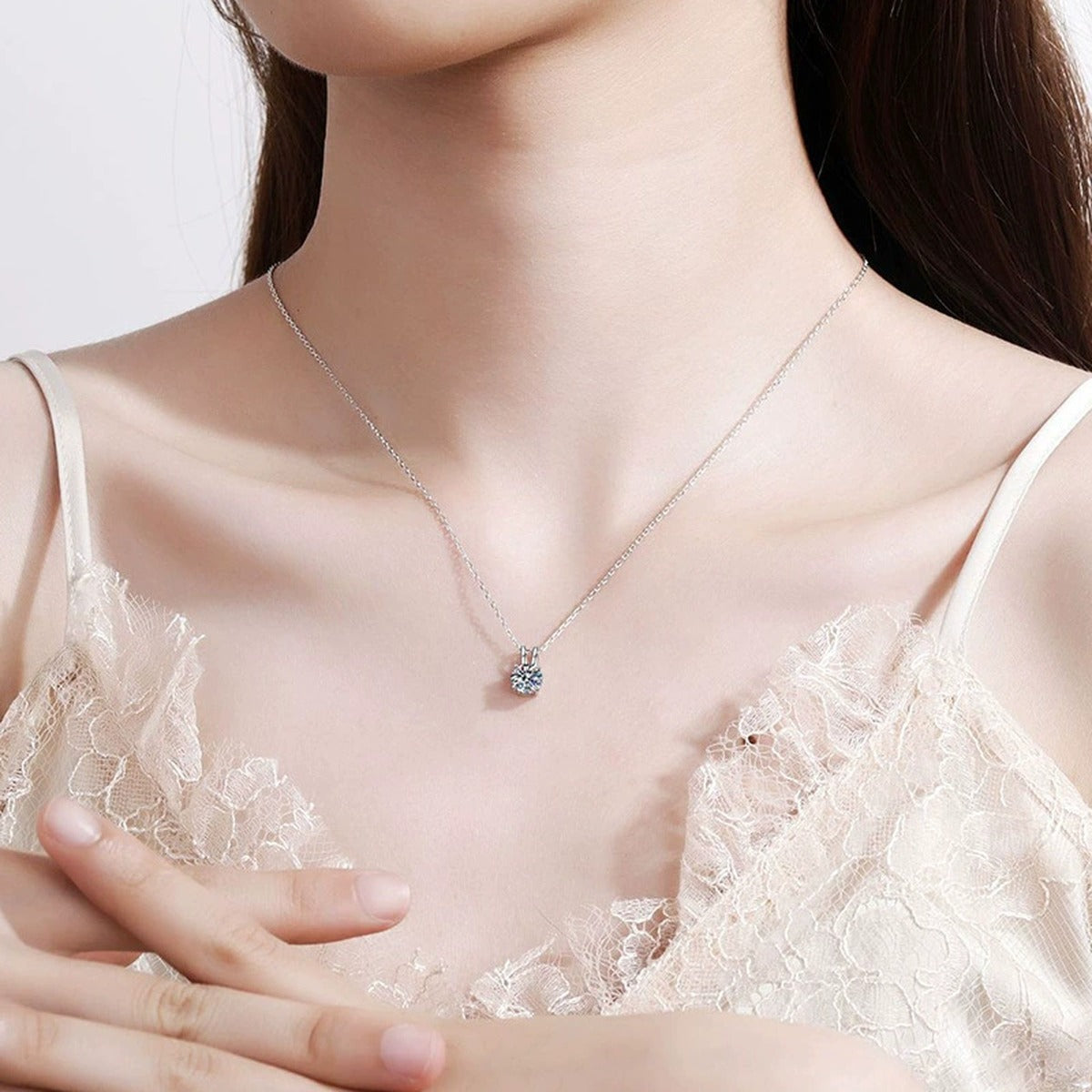 Round Solitaire Moissanite Pendant Necklace in Platinum-Plated S925 Sterling Silver worn on neckline by model