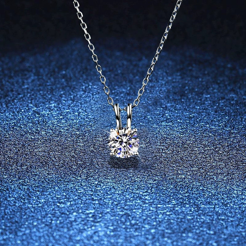 Round Solitaire Moissanite Pendant Necklace in Platinum-Plated S925 Sterling Silver blue background product view