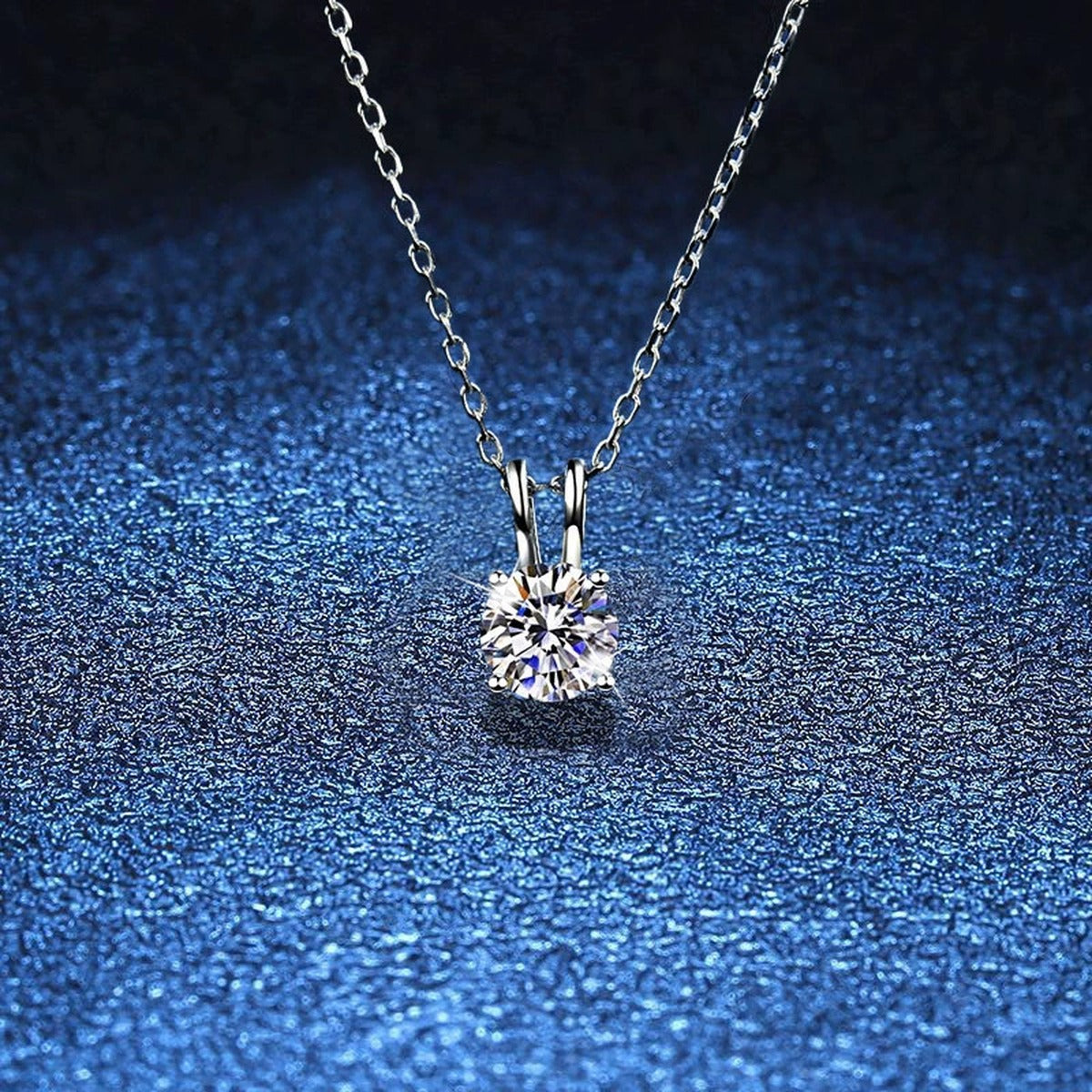 Round Solitaire Moissanite Pendant Necklace in Platinum-Plated S925 Sterling Silver blue background product view