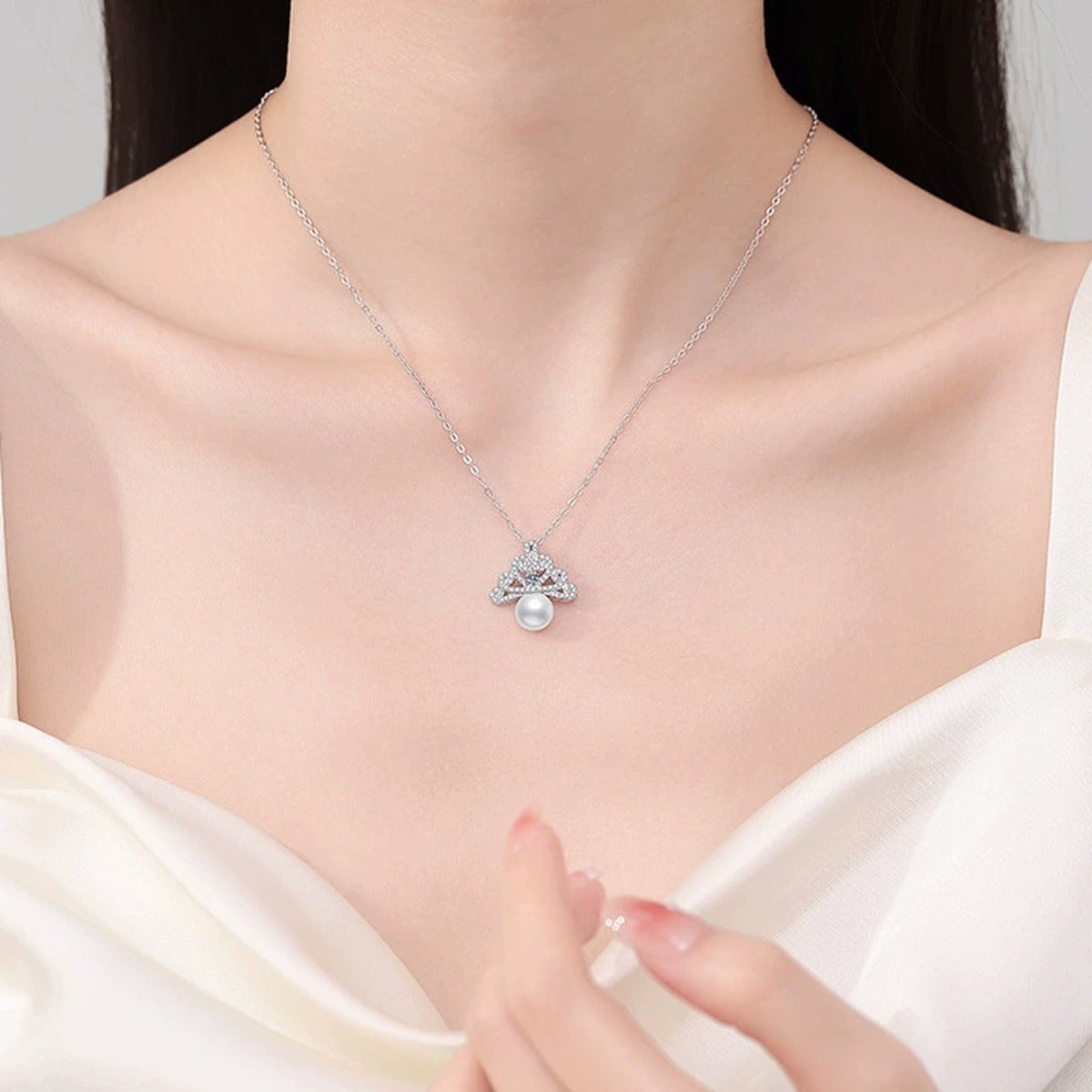 Crown Pearl Moissanite Pendant Necklace with Cubic Zirconia in White Gold-Plated S925 Sterling Silver worn on neckline by model