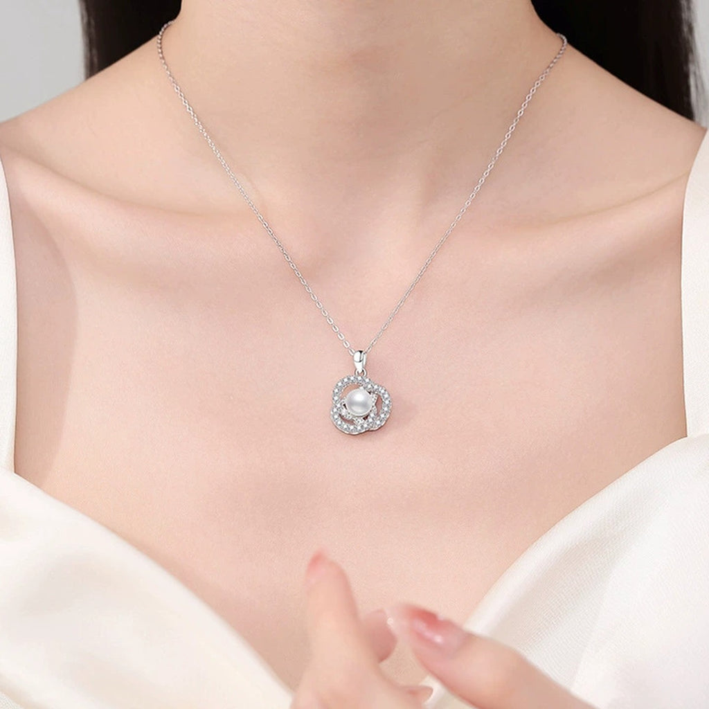 Circle Freshwater Pearl Pendant Necklace with Cubic Zirconia in White Gold-Plated S925 Sterling Silver worn on neckline by model