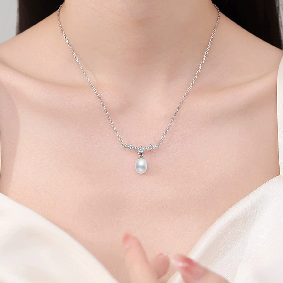 Station Moissanite Freshwater Pearl Necklace in White Gold-Plated S925 Sterling Silver worn on neckline by model