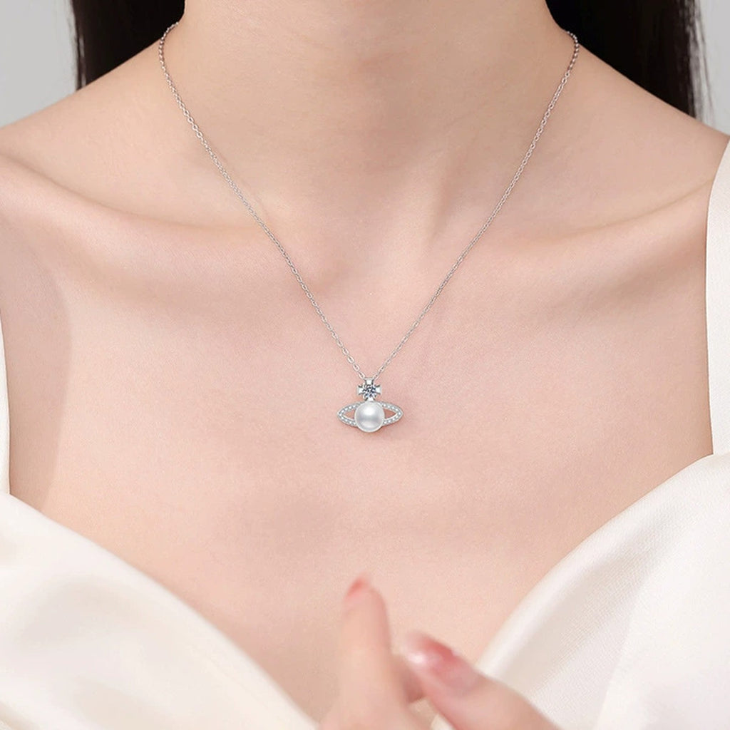 Orbit Moissanite Freshwater Pearl Pendant Necklace with Cubic Zirconia in White Gold-Plated S925 Sterling Silver worn on neckline by model