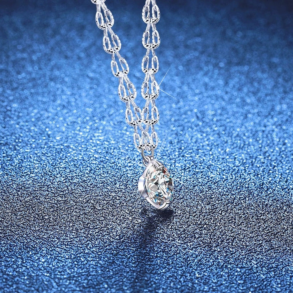 Round Moissanite Pendant Necklace in White Gold-Plated S925 Sterling Silver blue background product view