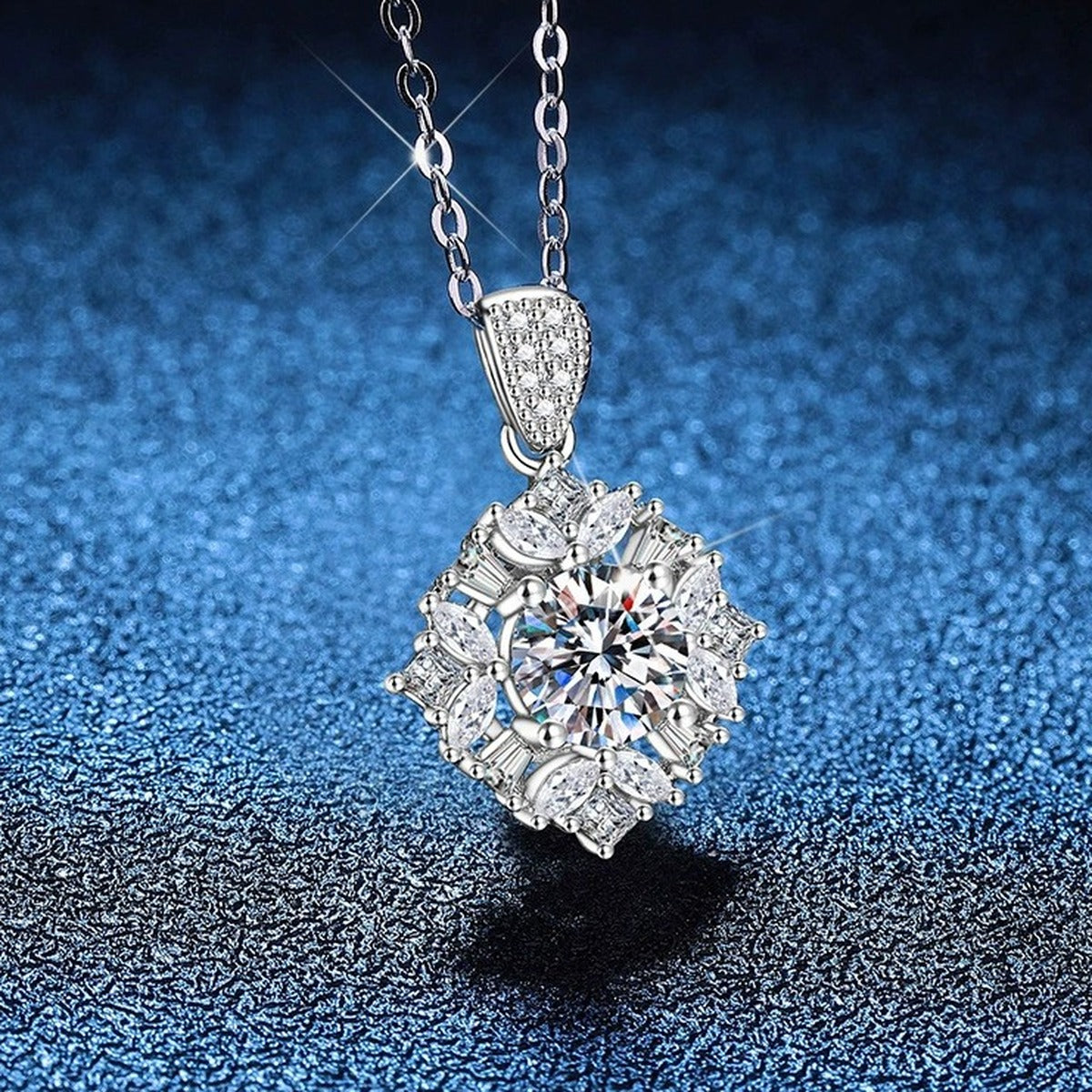 Floral Halo Moissanite Pendant Necklace with Cubic Zirconia in Platinum-Plated S925 Sterling Silver blue background close-up view