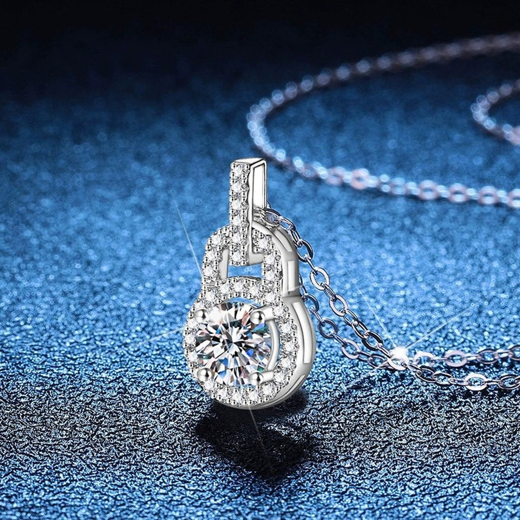 Oval Halo Moissanite Pendant Necklace with Cubic Zirconia in Platinum-Plated S925 Sterling Silver blue background angled view