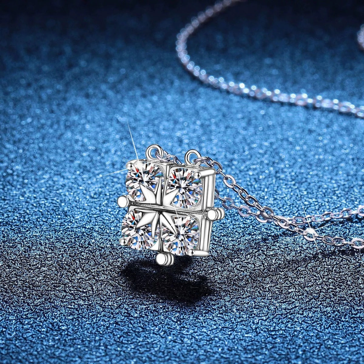 Geometric Four-Stone Moissanite Collar Necklace in Platinum-Plated S925 Sterling Silver blue background angled view