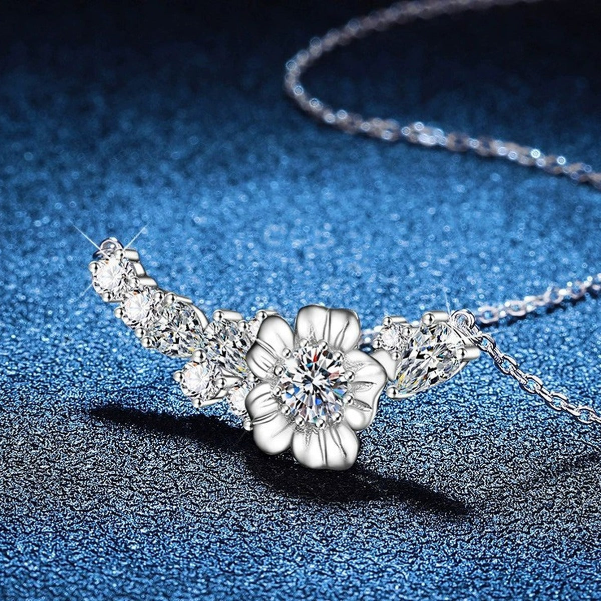 Floral Moissanite Collar Necklace with Cubic Zirconia in Platinum-Plated S925 Sterling Silver blue background angled view