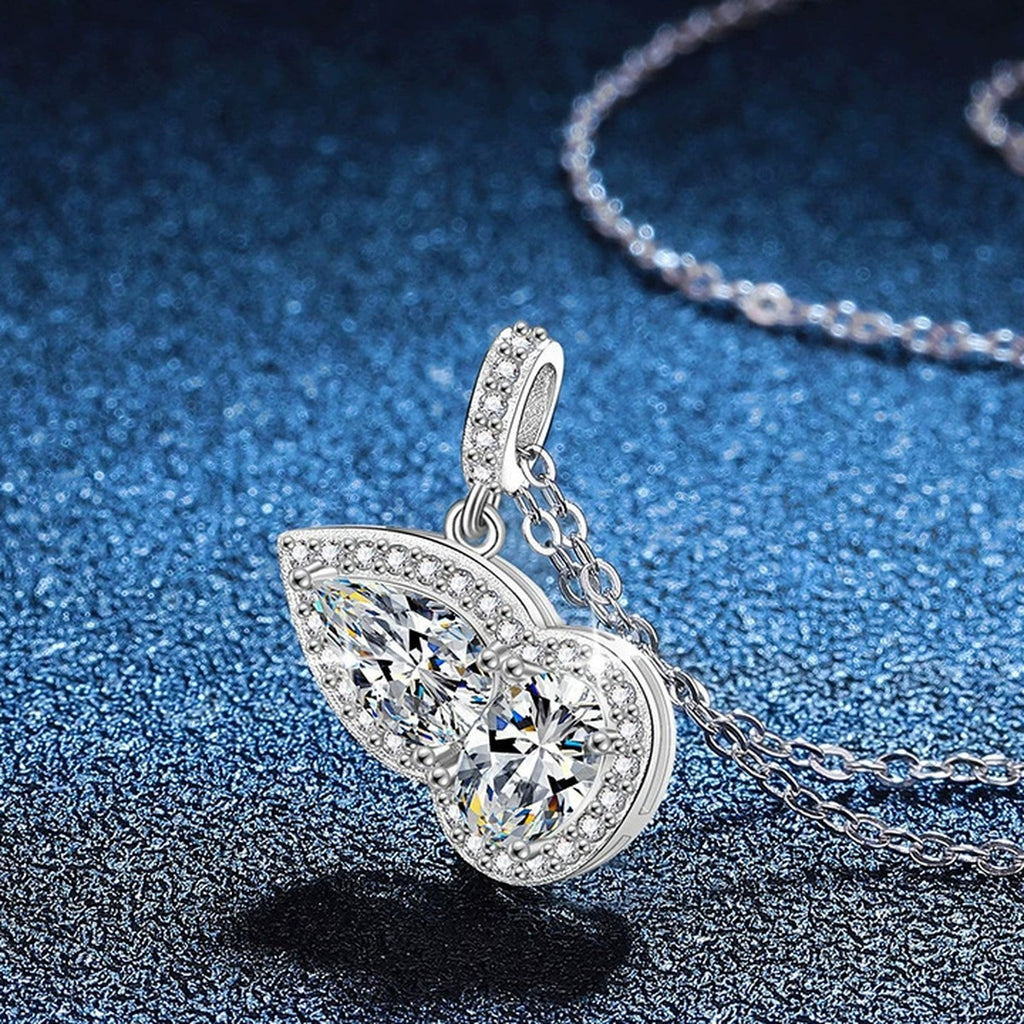 Two-Stone Pear Moissanite Pendant Necklace with Cubic Zirconia in Platinum-Plated S925 Sterling Silver blue background product view