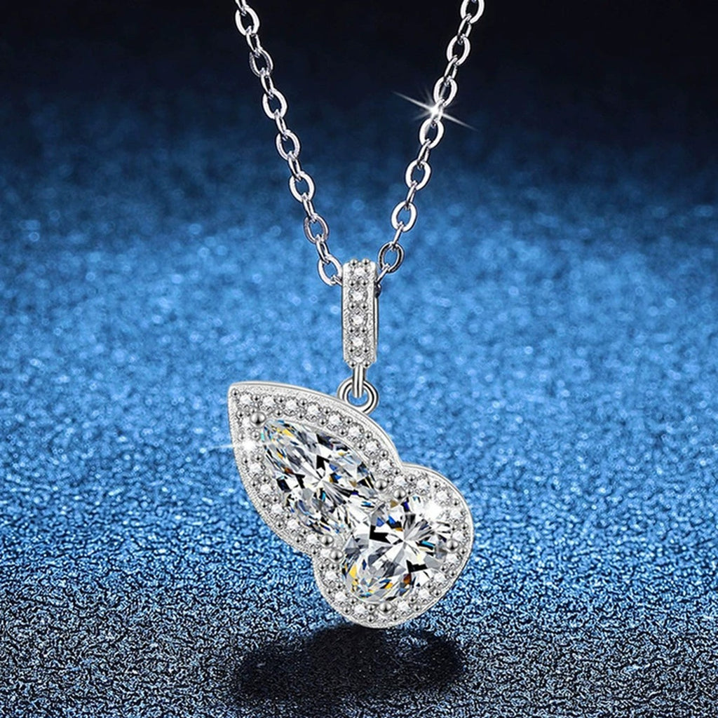 Two-Stone Pear Moissanite Pendant Necklace with Cubic Zirconia in Platinum-Plated S925 Sterling Silver blue background angled view