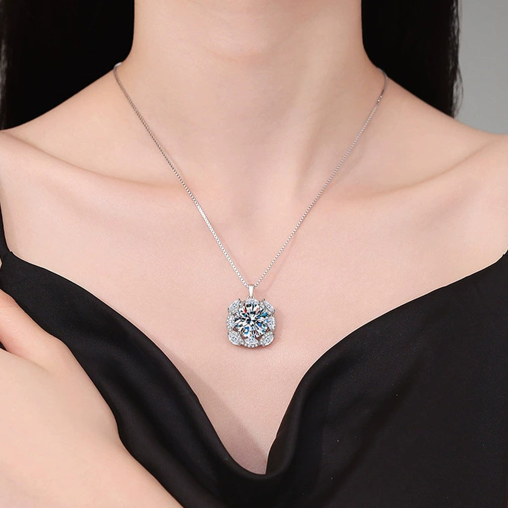Large Moissanite Halo Pendant Necklace with Cubic Zirconia in Platinum-Plated S925 Sterling Silver worn on neckline by model