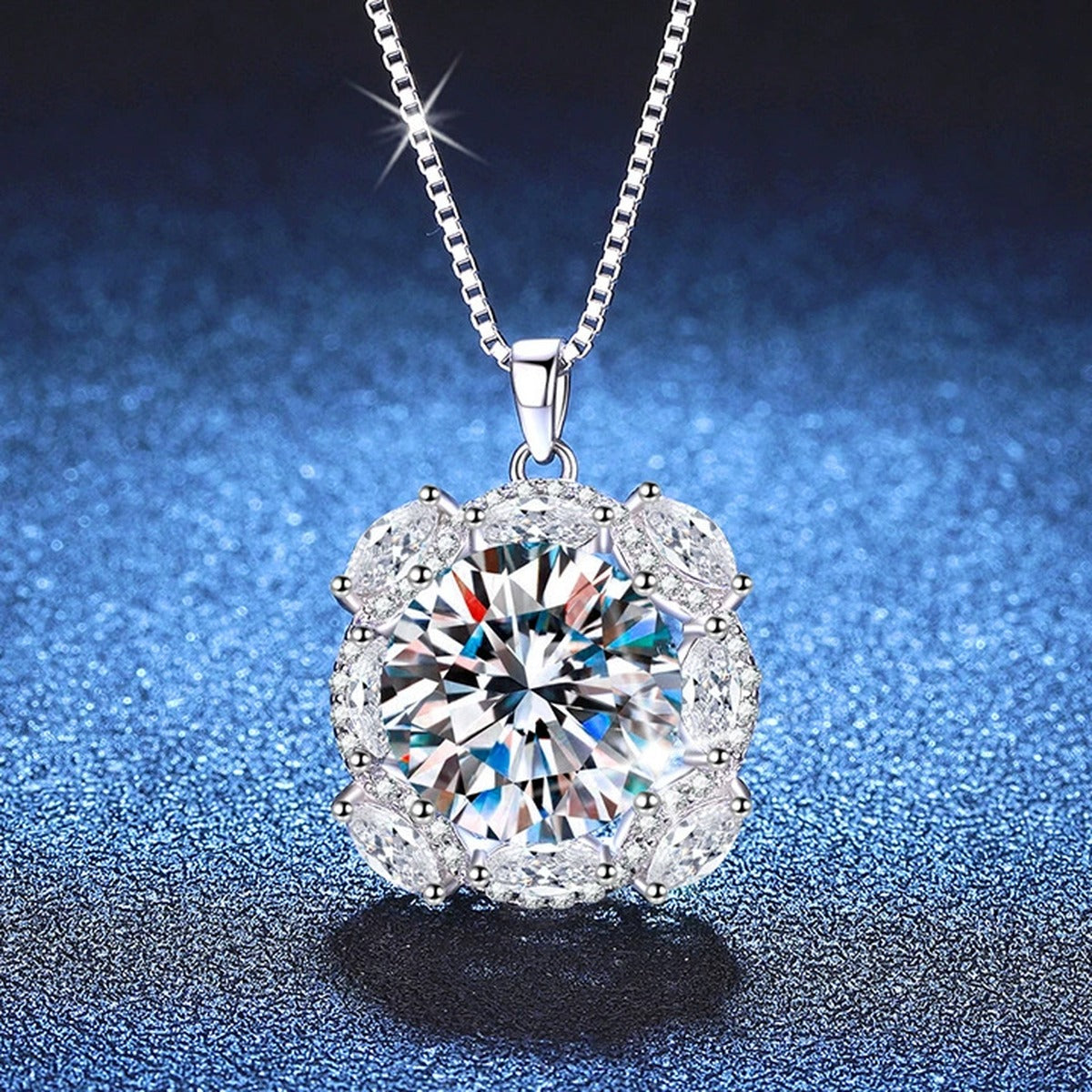 Large Moissanite Halo Pendant Necklace with Cubic Zirconia in Platinum-Plated S925 Sterling Silver blue background angled view
