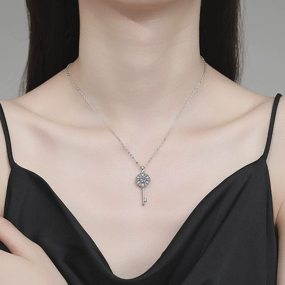Key Moissanite Pendant Necklace with Cubic Zirconia in Platinum-Plated S925 Sterling Silver worn on neckline by model