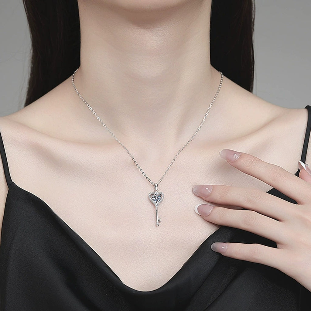 Heart Key Moissanite Pendant Necklace with Cubic Zirconia in Platinum-Plated S925 Sterling Silver worn on neckline by model