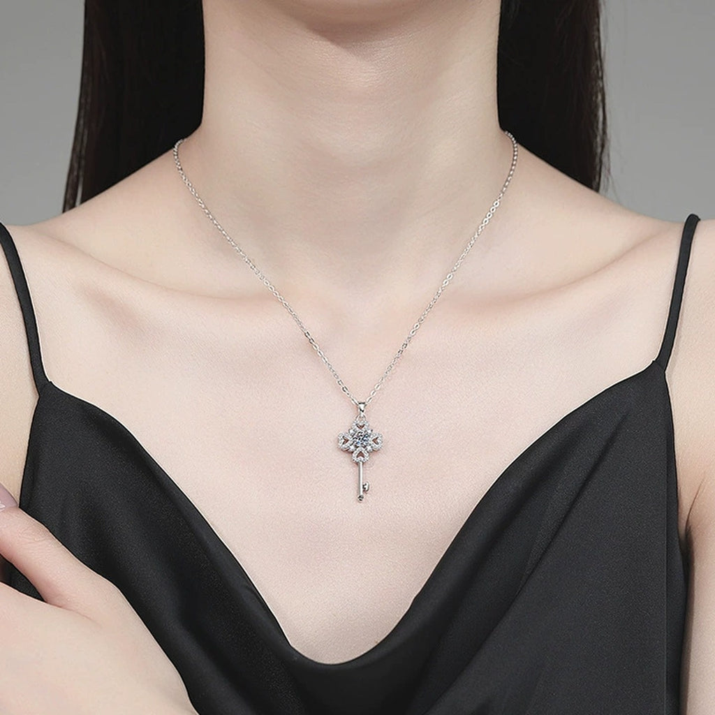 Floral Key Moissanite Pendant Necklace with Cubic Zirconia in Platinum-Plated S925 Sterling Silver worn on neckline by model