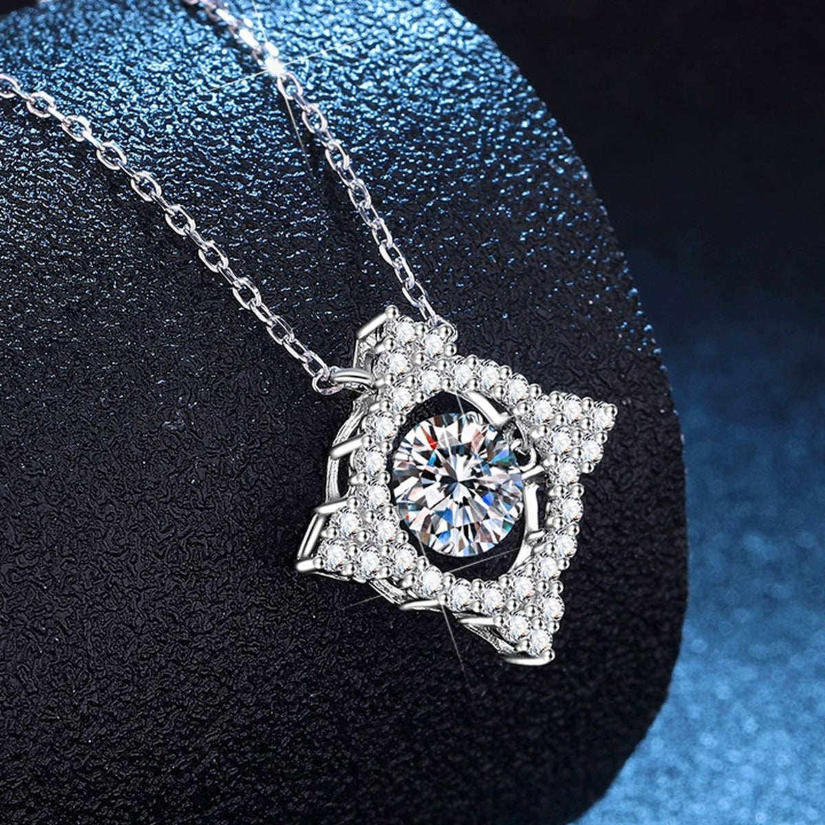 Kite Halo Moissanite Pendant Necklace with Cubic Zirconia in Platinum-Plated S925 Sterling Silver blue background angled view